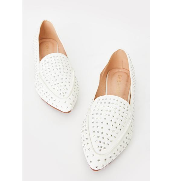 white pointy flats