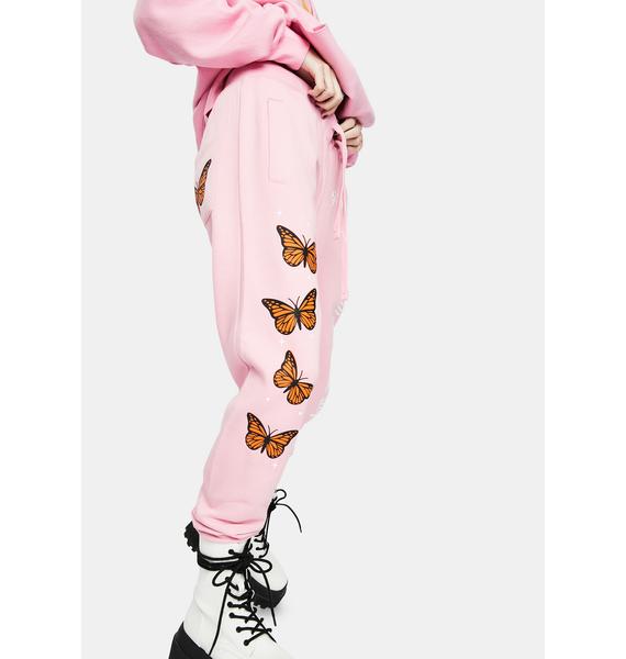 white sweatpants with butterflies