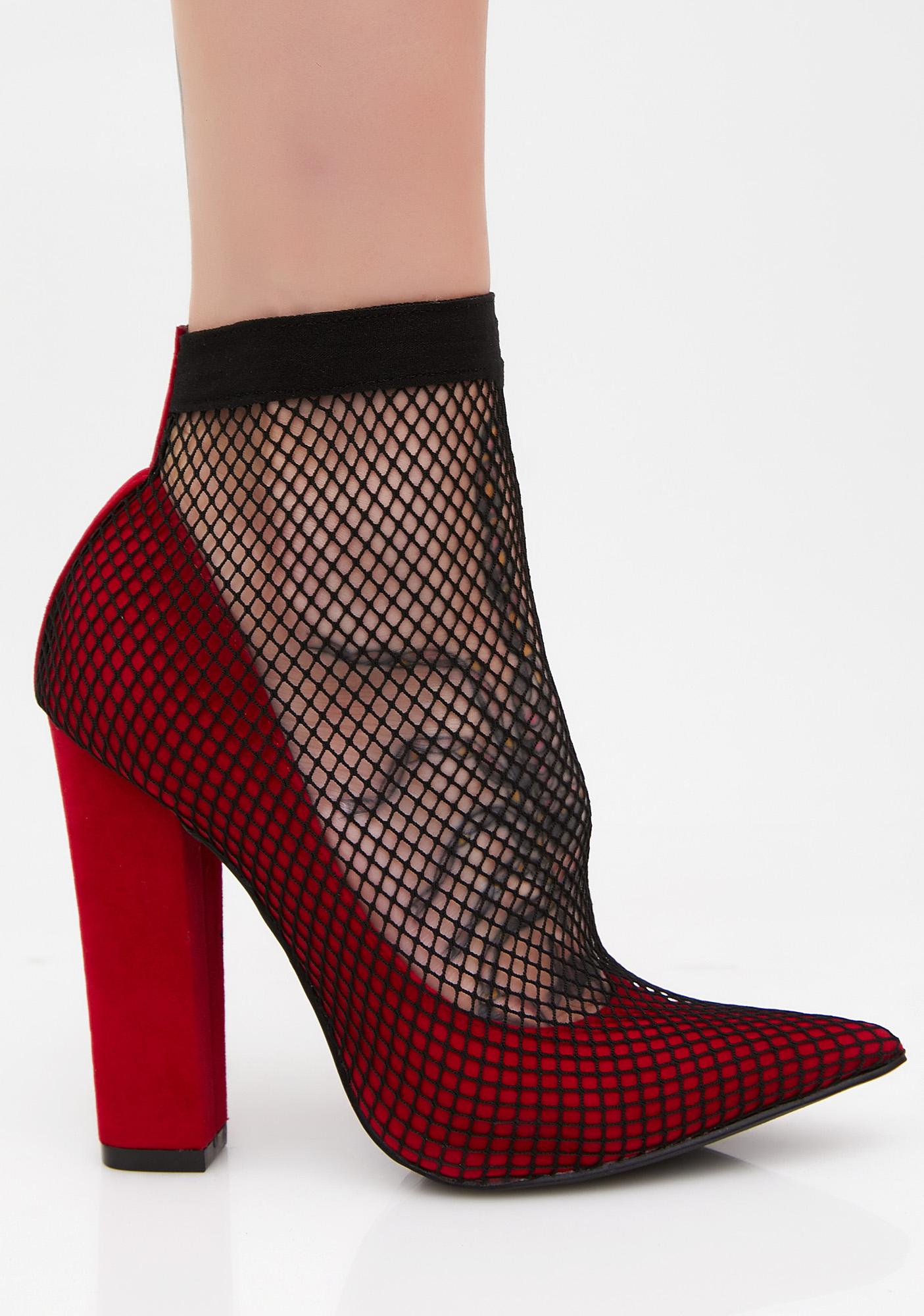 red fishnet heels