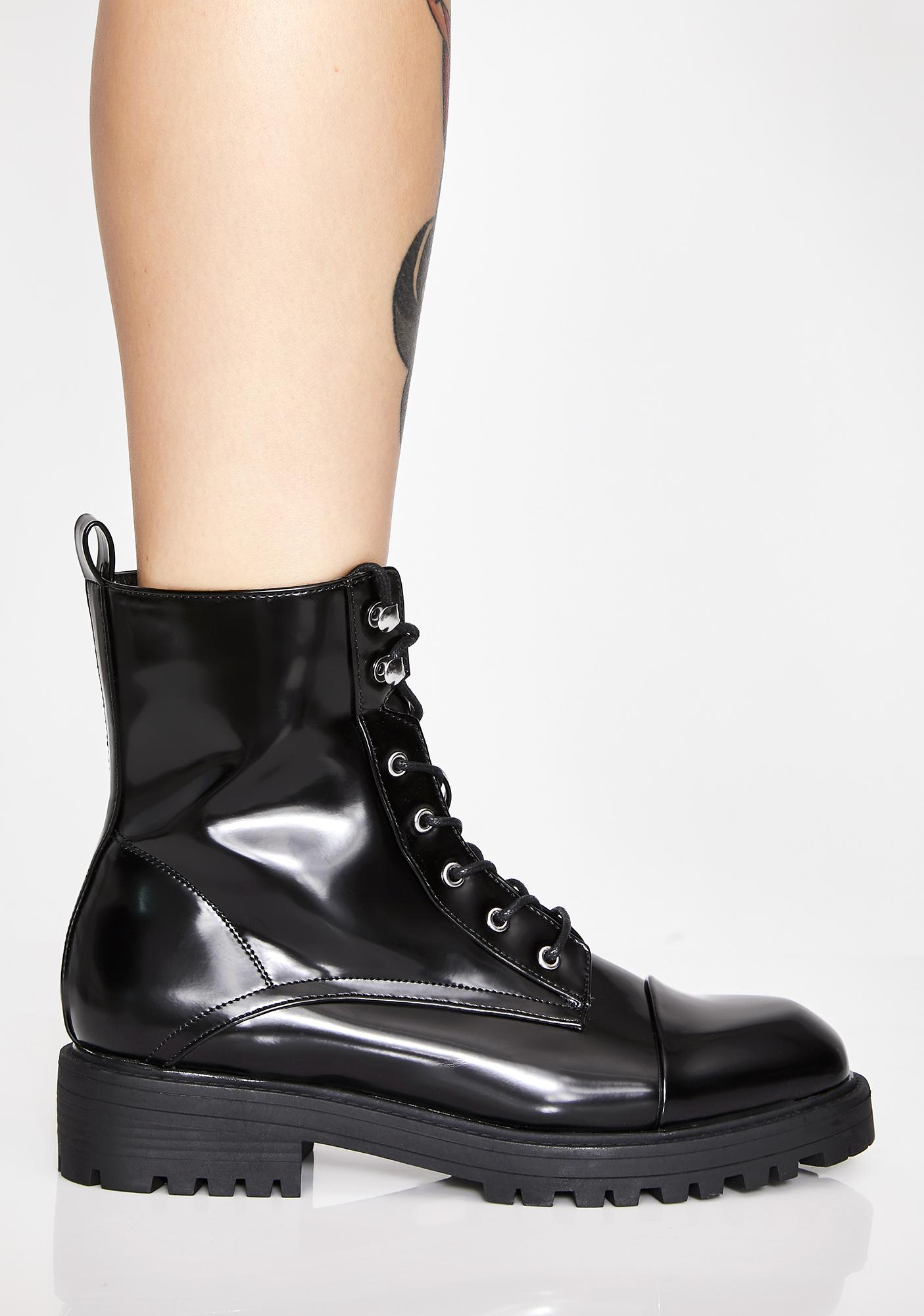 shiny black combat boots