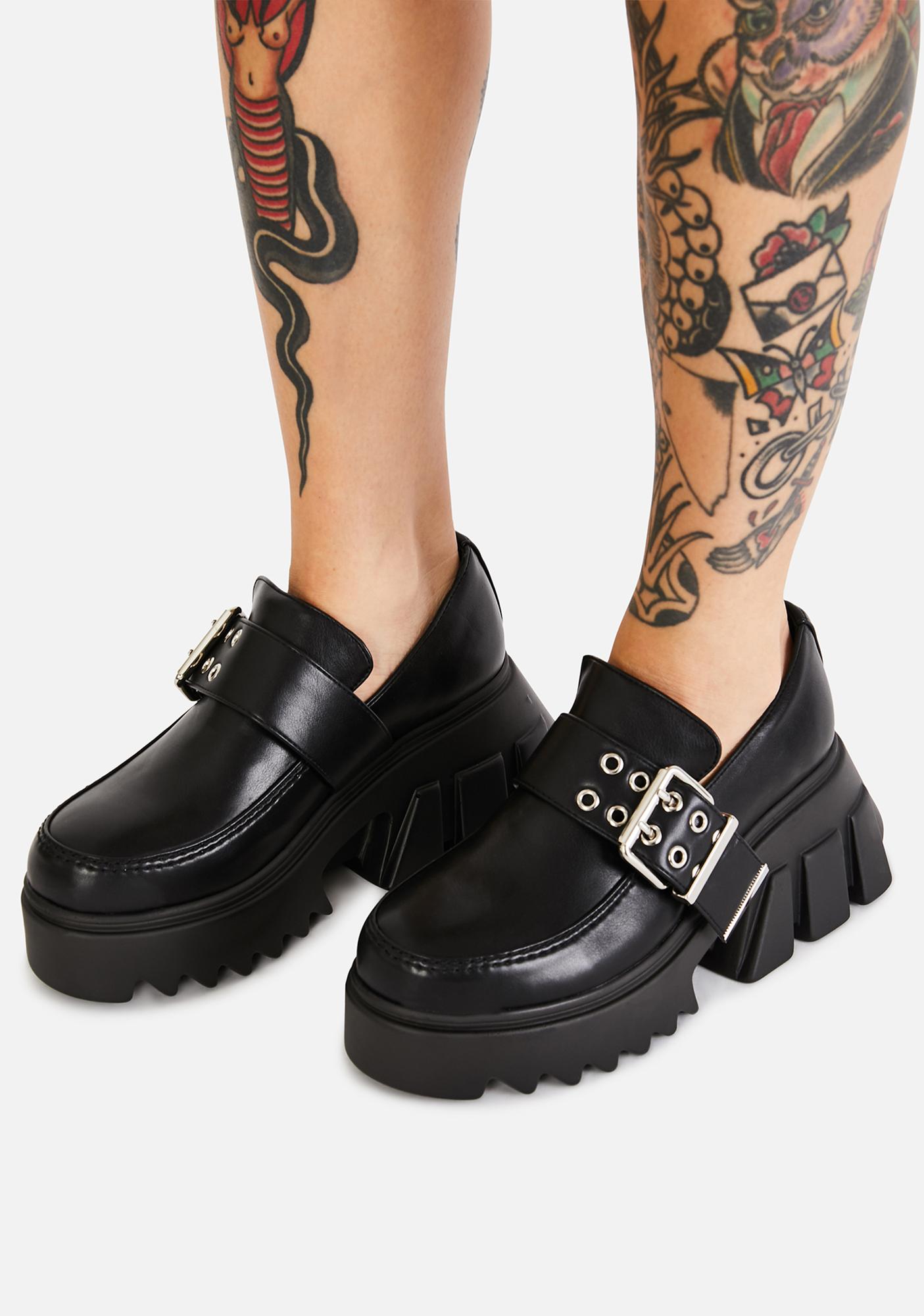 black loafers with buckle
