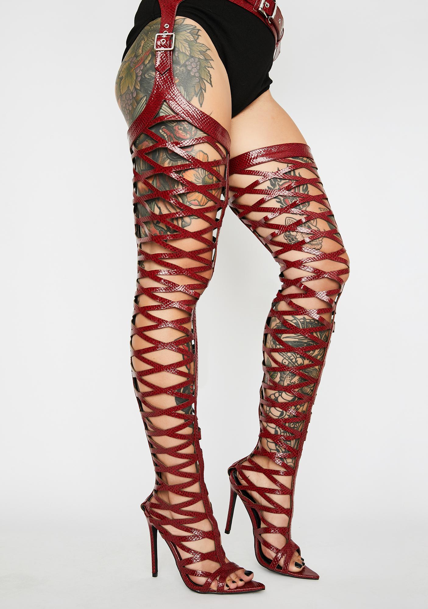 red thigh high boots with belt