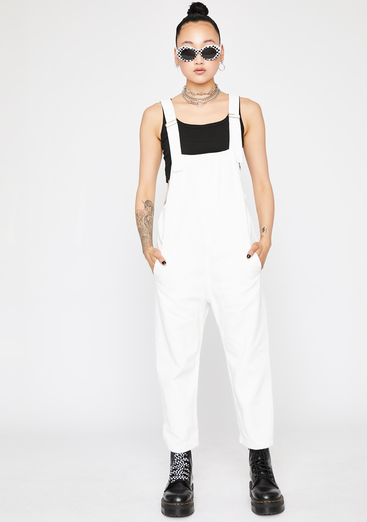white baggy overalls