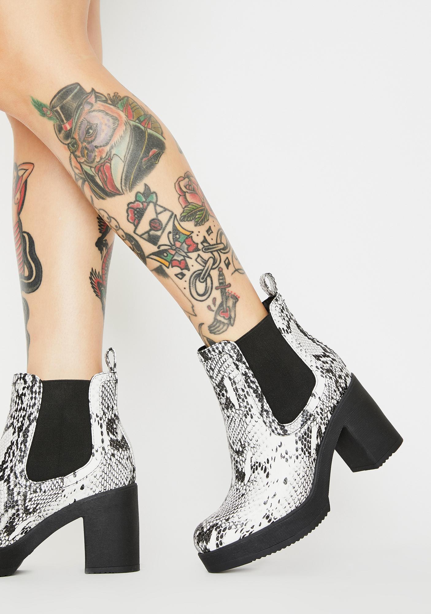 white snakeskin ankle boots