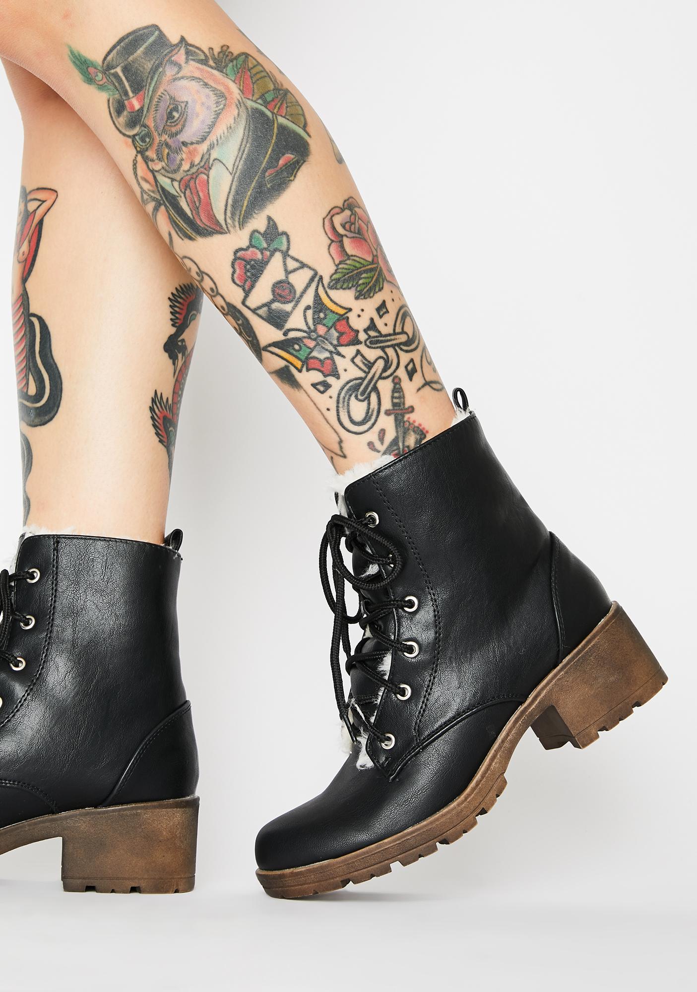 black heeled boots with fur trim