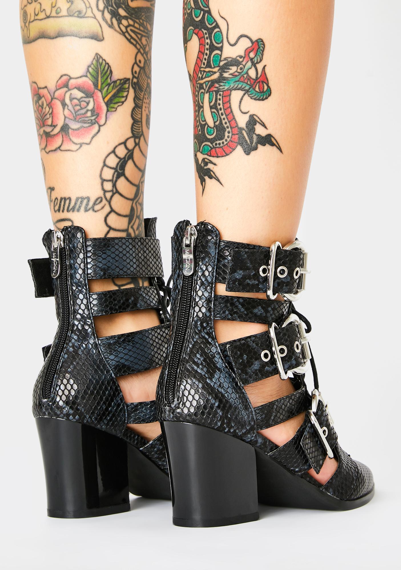 snakeskin buckle boots