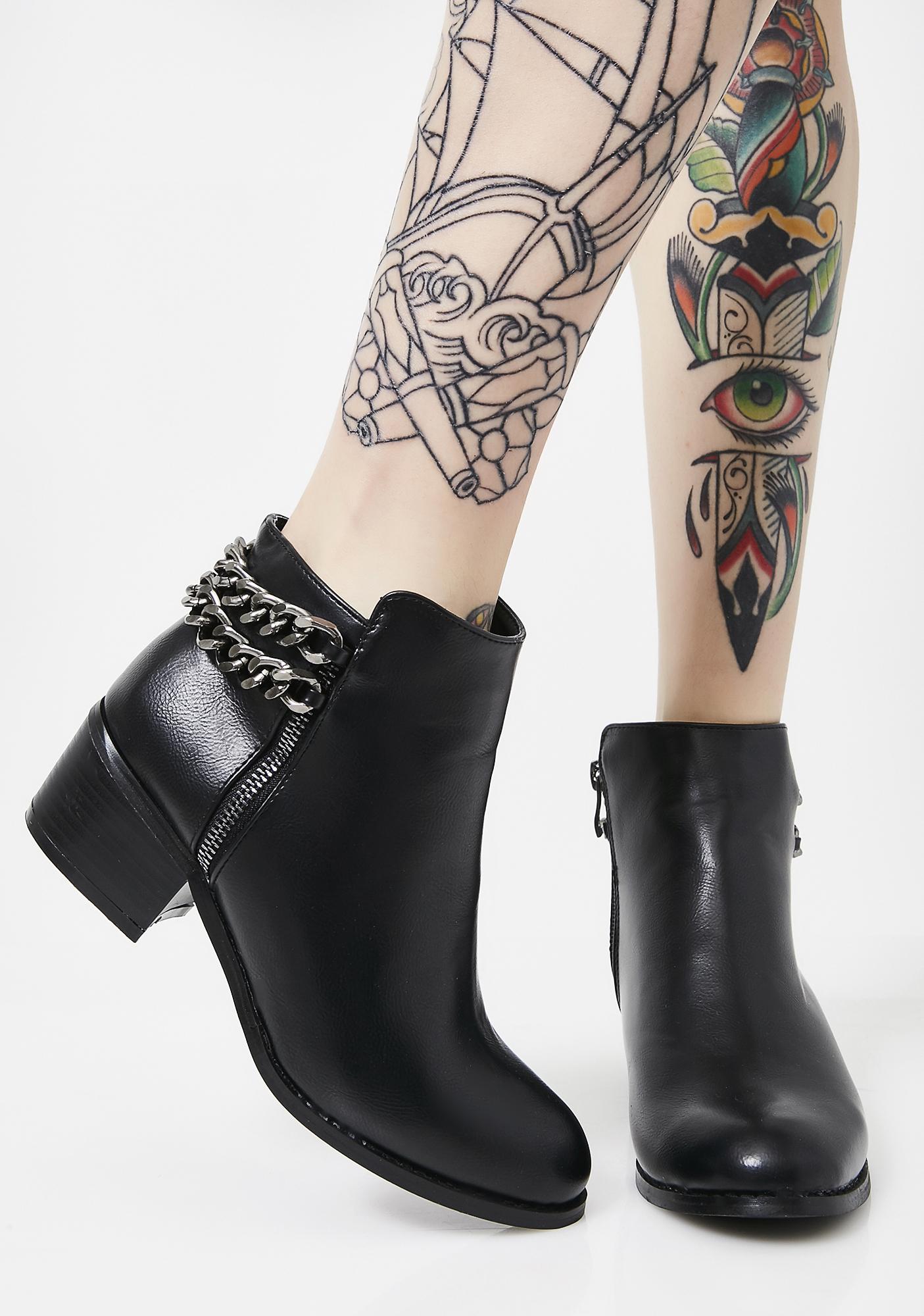 black chain ankle boots