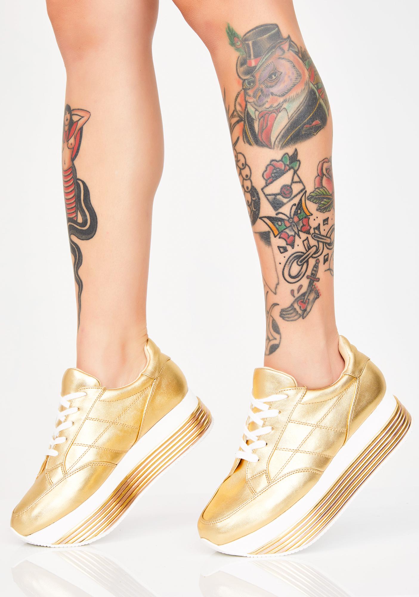 gold platform sneakers